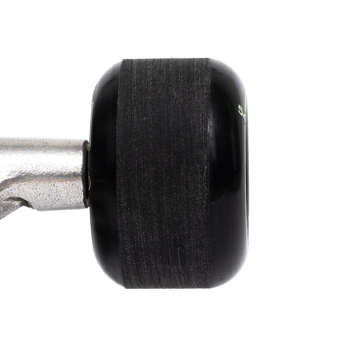 Close-up of a black wheel on a skateboard truck  on a white background with stone ground contact patch